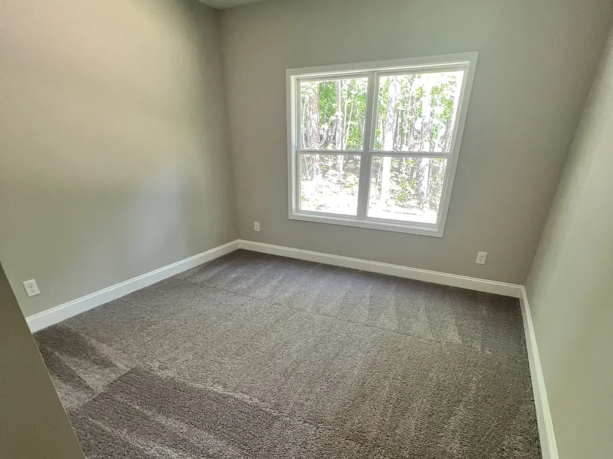Freshly cleaned bedroom carpet with extraction lines after carpet cleaning in Cape Cod, MA