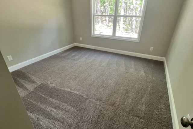 Freshly cleaned bedroom carpet with extraction lines after carpet cleaning in Cape Cod, MA