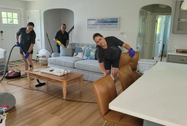 Sherlock Holmes Cleaning crew doing house cleaning in a Cape Cod, MA living room